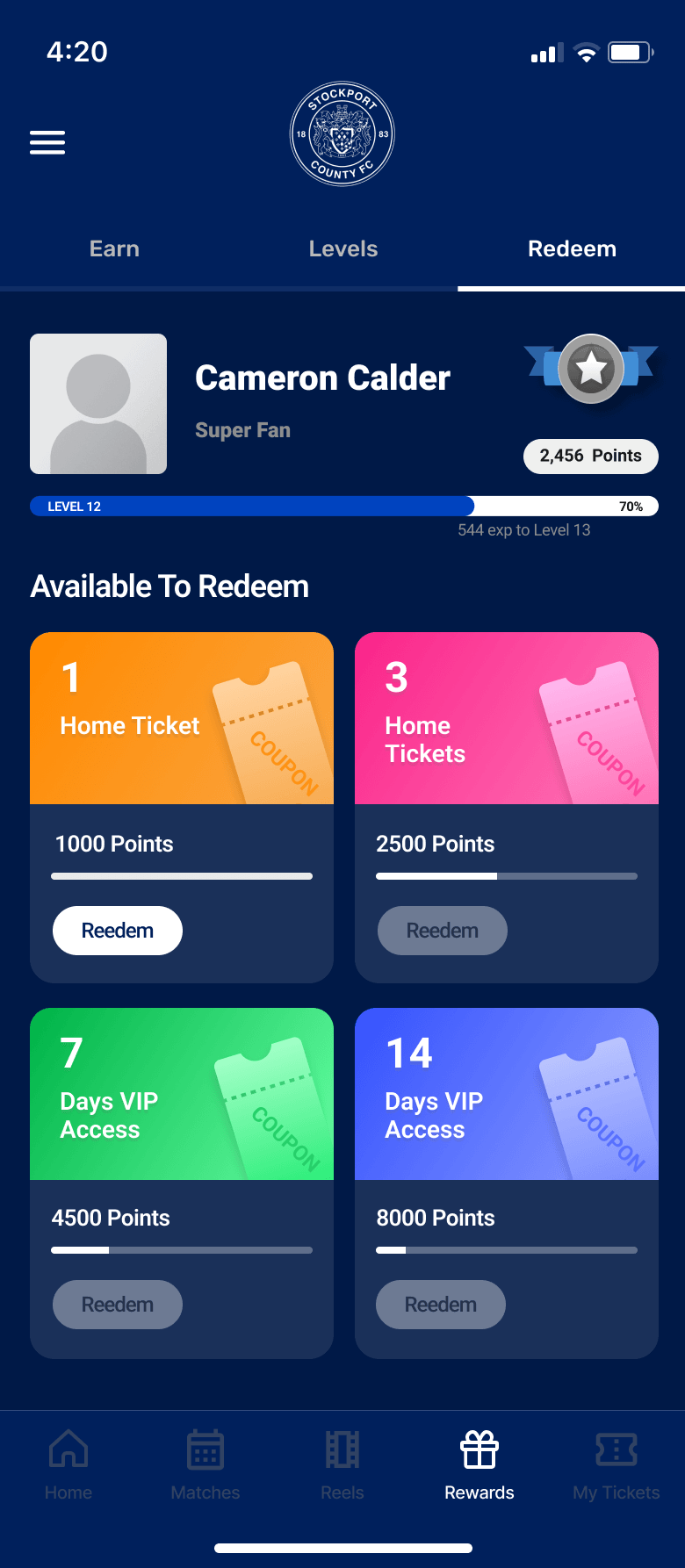 Rewards redeem screen showing home-ticket and VIP-access coupons with points thresholds