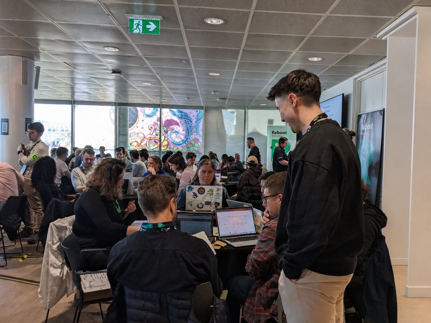 Cameron Calder coaching a team at an annual financial-services hackathon